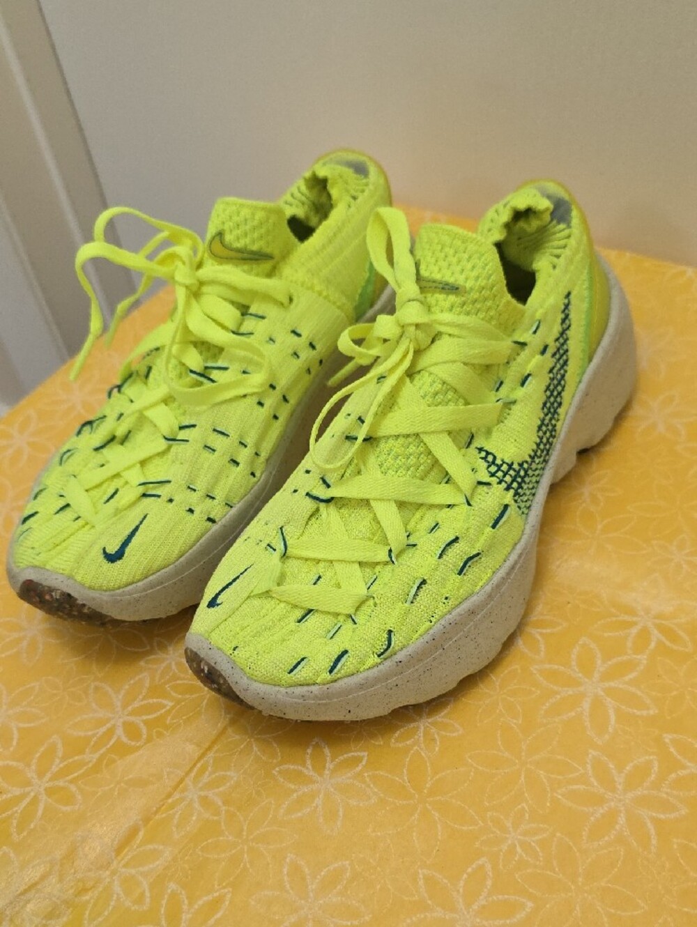 Nike Space Hippie 04 sneakers feature a vibrant "Light Lemon Twist" neon green